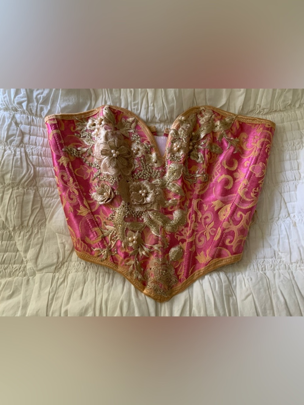 Pink and gold corset with embroidered flowers, lace, pearls and gems